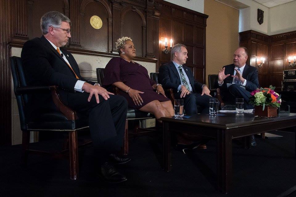 President DeGioia sits on stage with a panel consisting of Ángel Cabrera, Ph.D., DeRionne Pollard, Ph.D., and Scott Ralls, Ph.D.