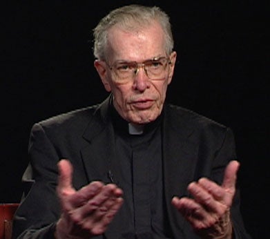 Walter Farrell, S.J., a white man with greying hair and glasses, wearing a minister's collar.