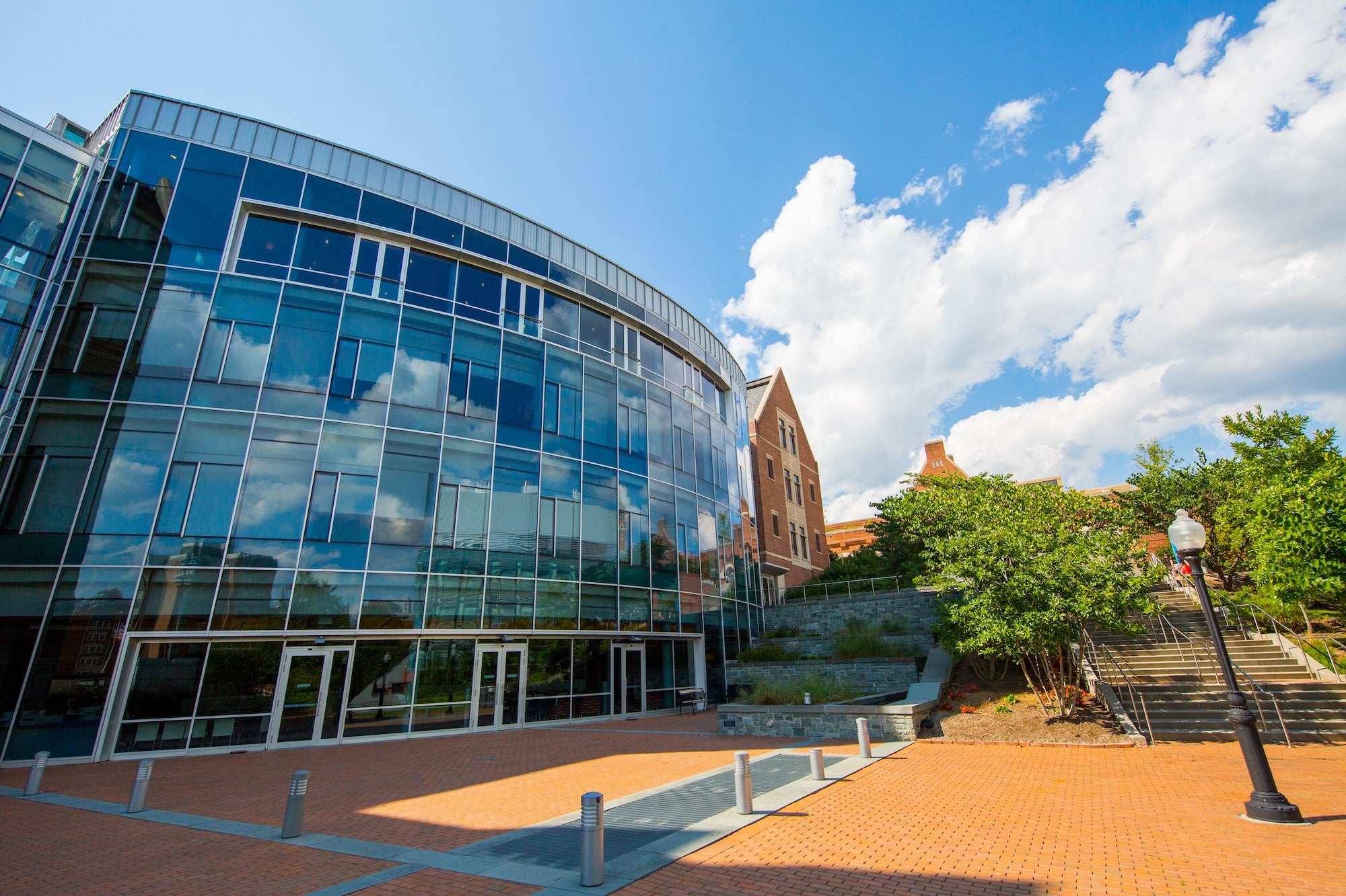 The exterior of the Hariri Building's all-glass exterior on a sunny day