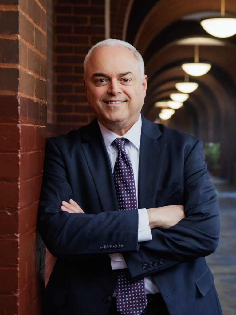 Joseph Ferrara, an older white man wearing a suit and tie.