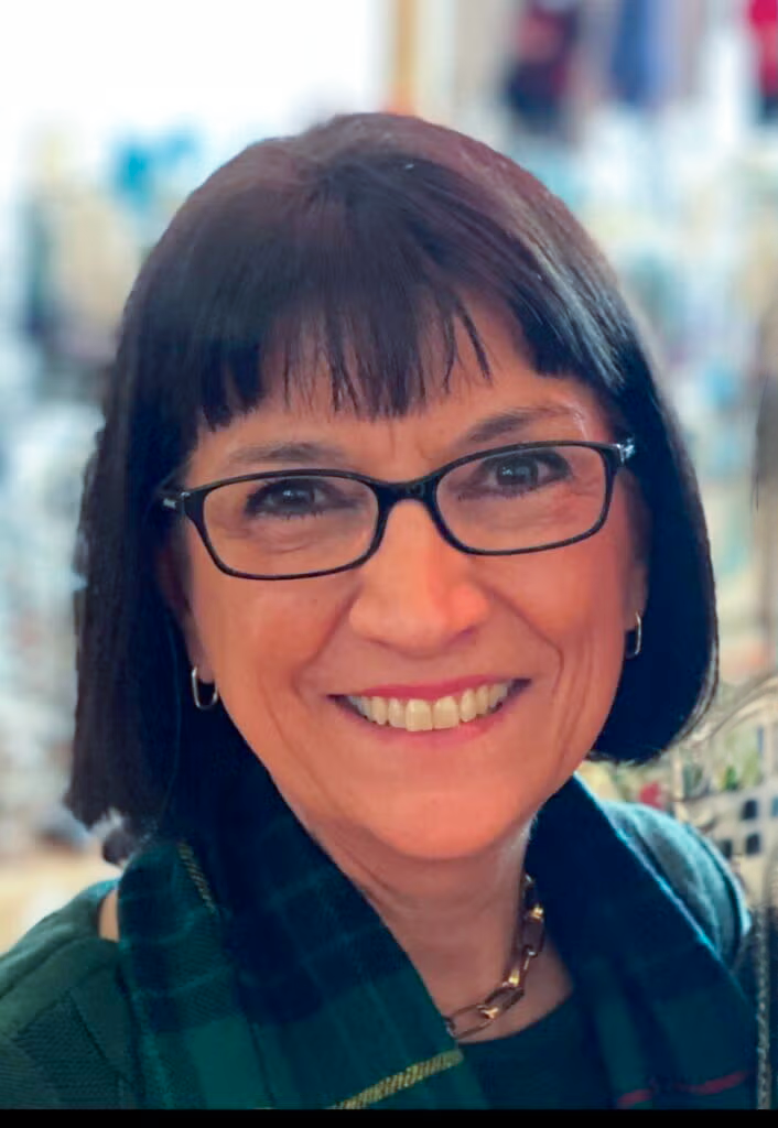 Marie Mattson, a white woman with dark hair and glasses.