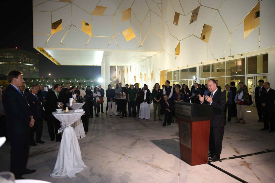 President DeGioia stands at a podium, addressing a group of people.