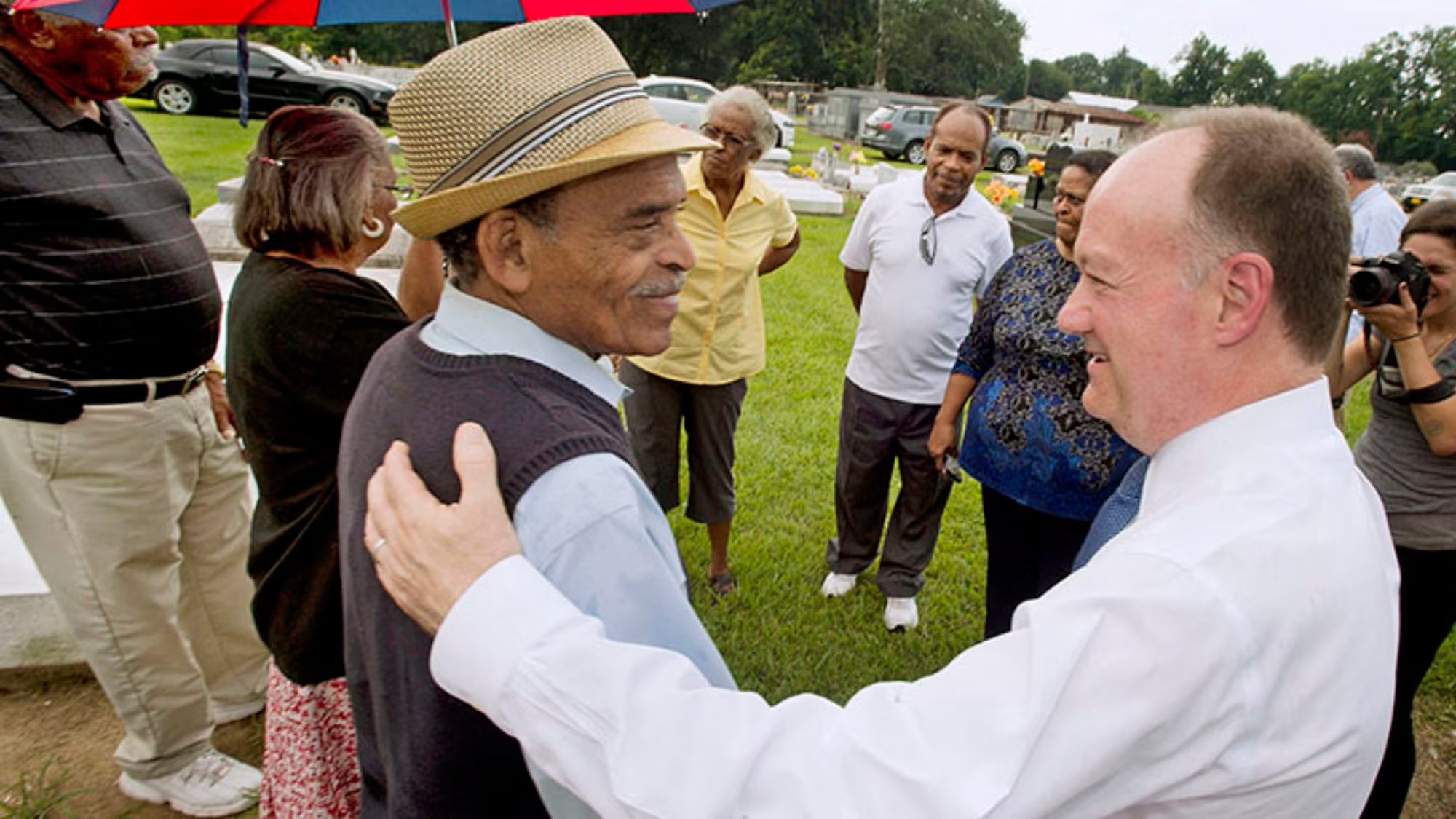 President John J. DeGioia shakes hands with GU 272 descendant Johnny Harris in Louisiana.