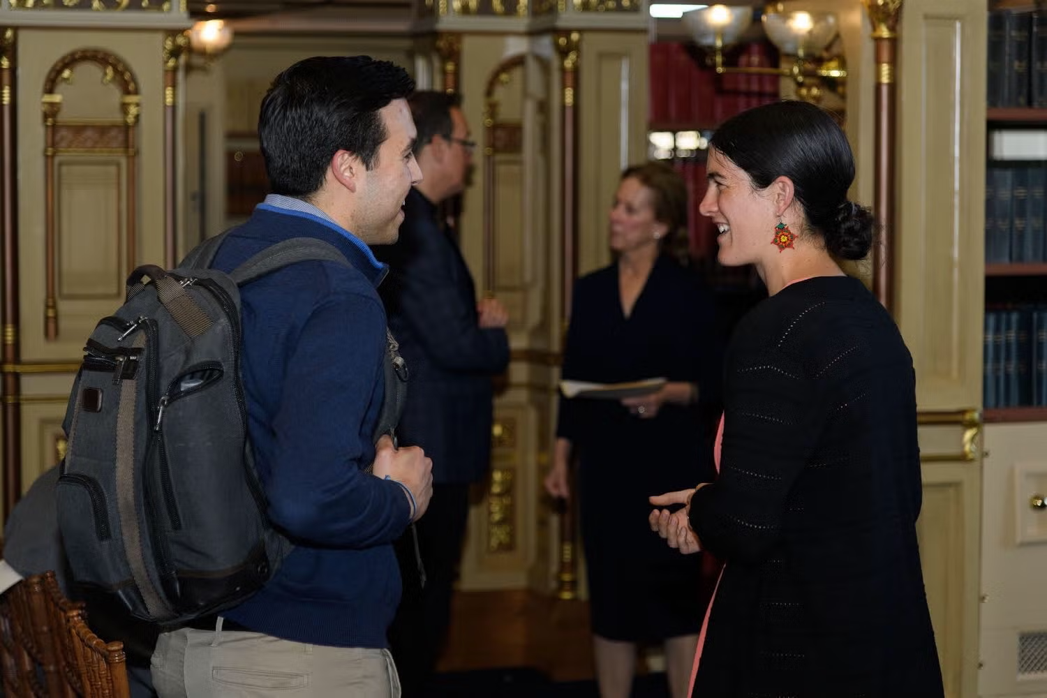 Joanna Foote Williams speaks with a lecture attendee.