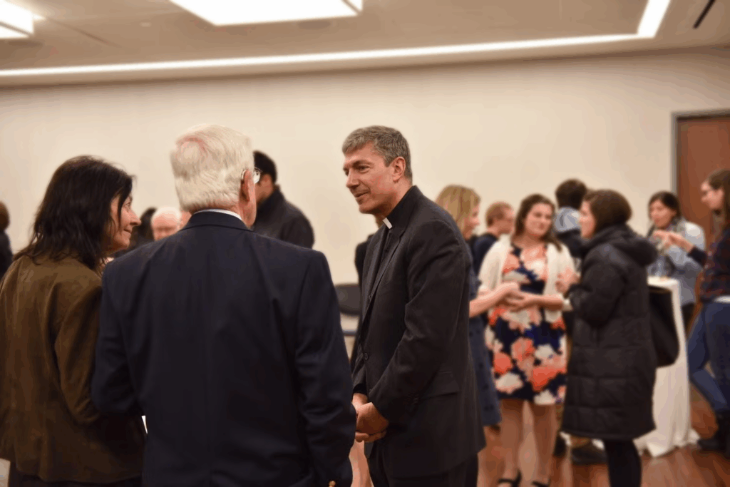Rev. Steve Katsouros, S.J. speaks with audience members.